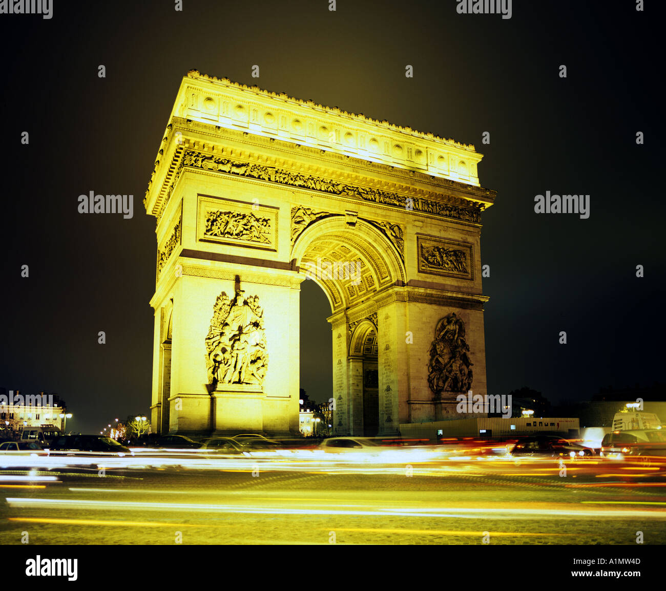 A night view of the Arc de Triomphe in Paris France` Stock Photo